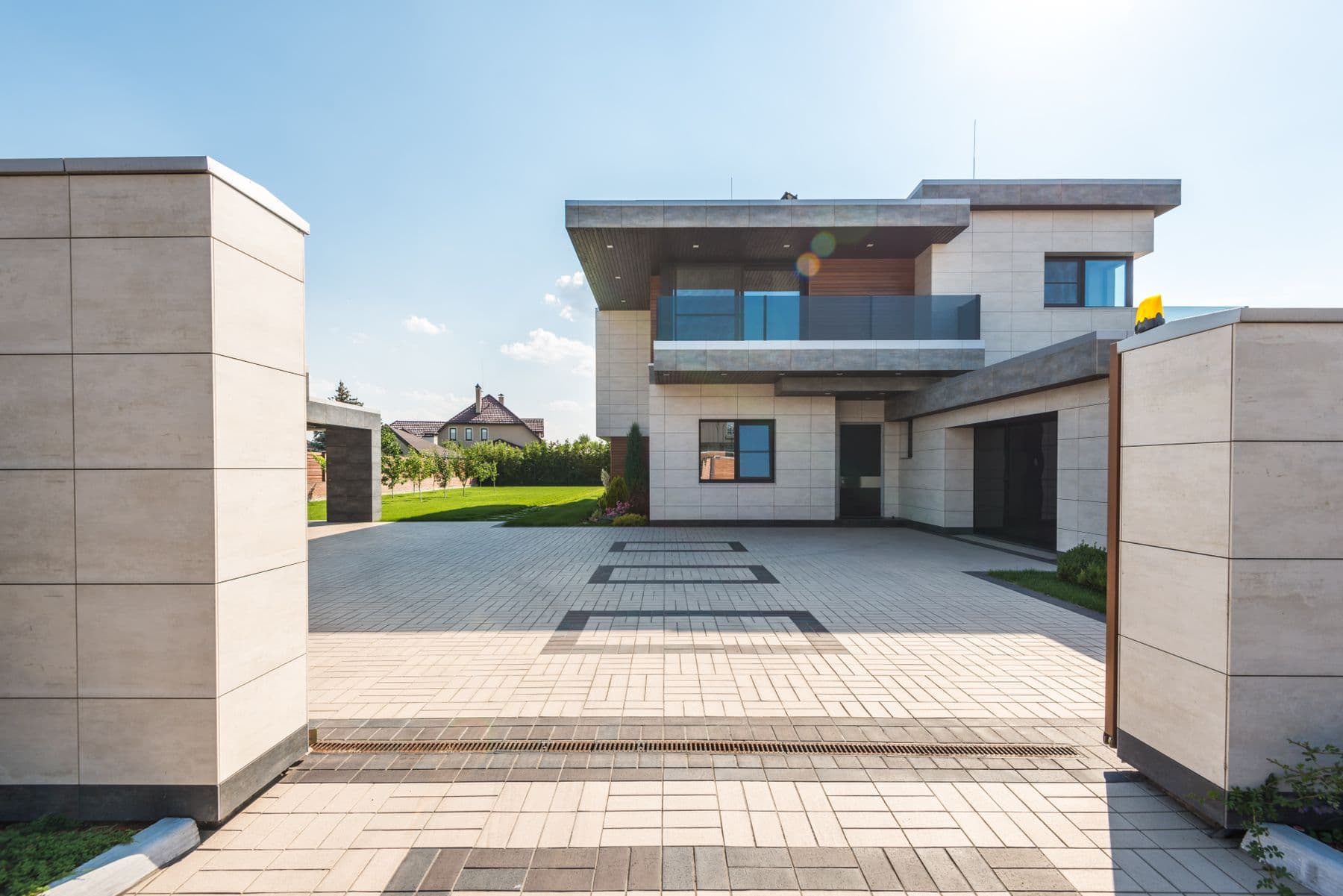 Completed contemporary custom home with a landscaped residential exterior